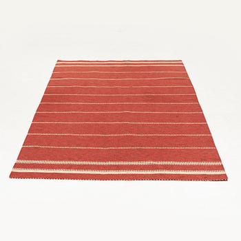 A flat weave rug, c. 310 x 190 cm.