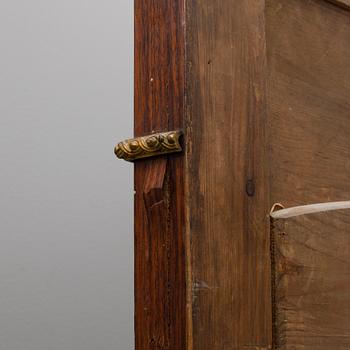 A full-length mirror from the late 19th century.