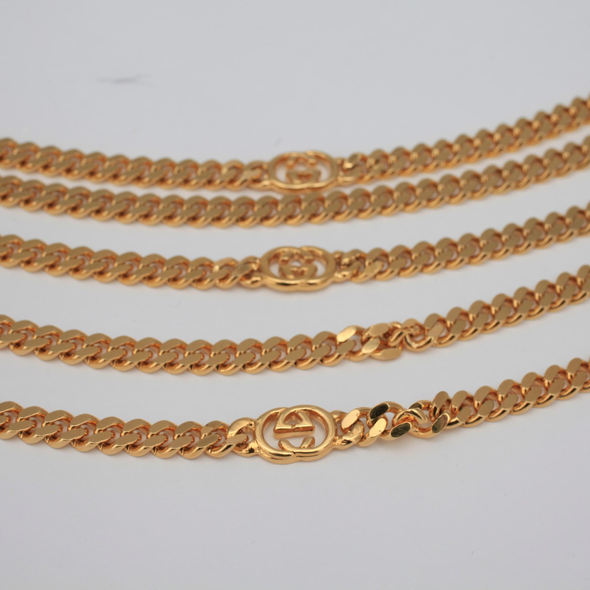 GUCCI, a necklace/belt.