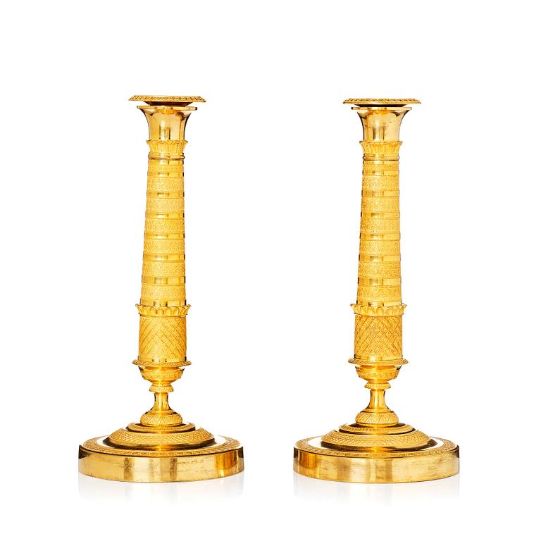 A pair of Empire candlesticks, early 19th century.