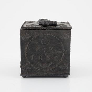 A cast iron tobacco jar, dated 1832.