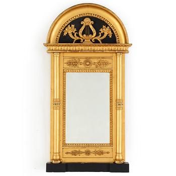 A 20th century Empire style gilt mirror.