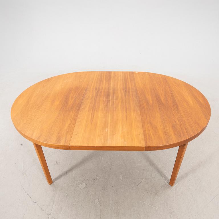A 1960s teak dining table.