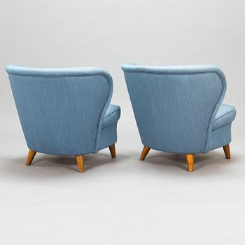 A pair of 1950's armchairs.