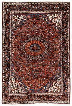 A semi-antique Abadeh carpet, approximately 296 x 191-196 cm.