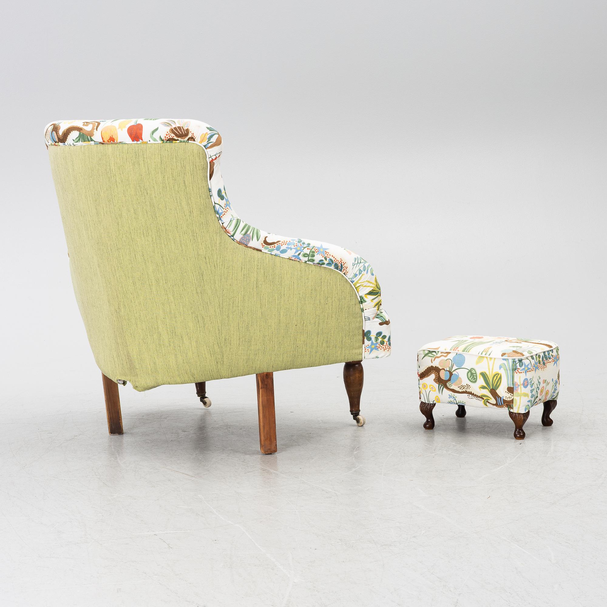 A corner lounge chair/sofa with a small ottoman, presumably early 20th century.