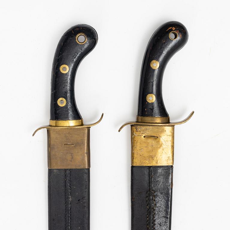 Two Swedish cutlasses 1848 pattern,with scabbards.