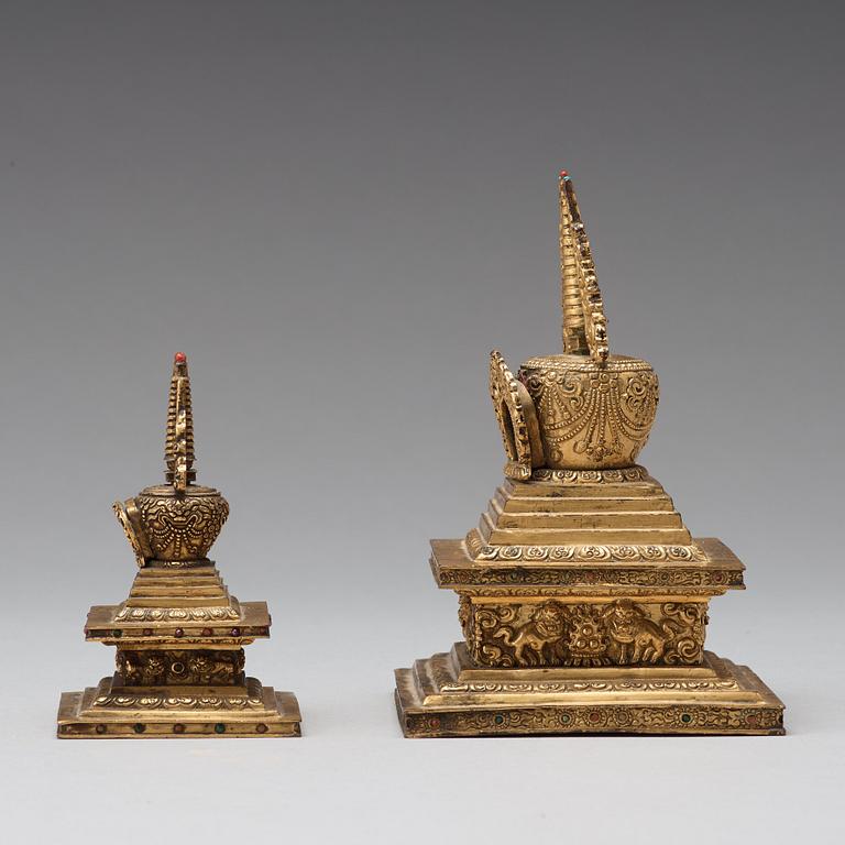 Two Tibetan gilt copper alloy stupa's, 19th Century.