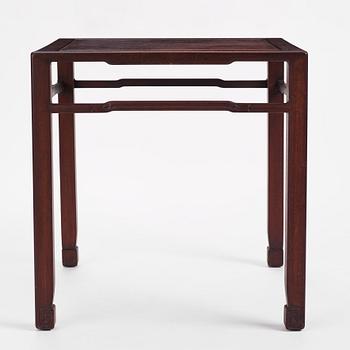 A Chinese hardwood corner-leg table, Qing dynasty.