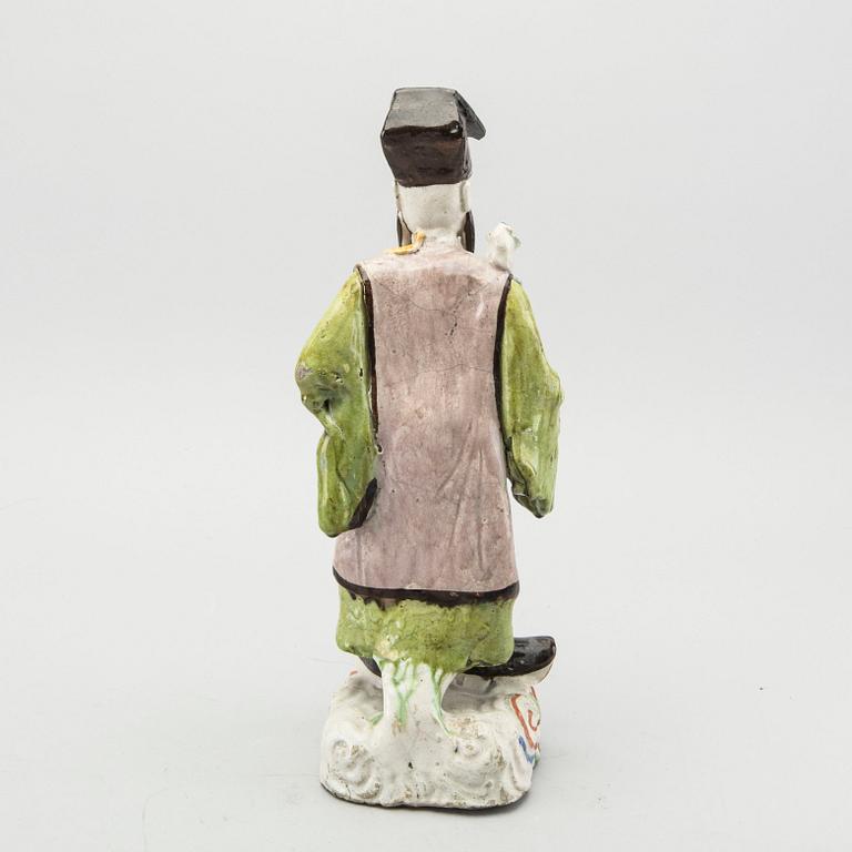 A Chinese porcelain figurine 19th century.