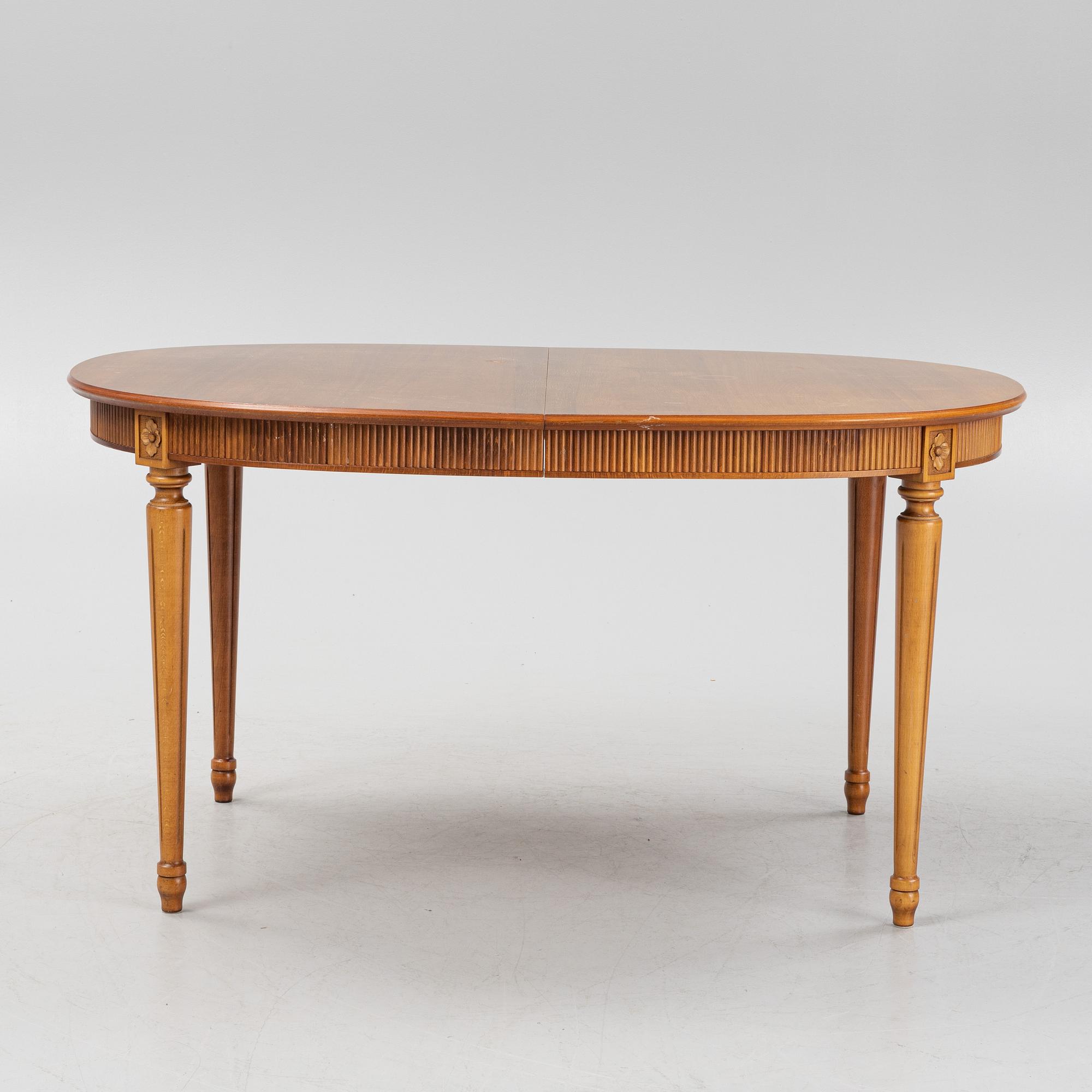 A Gustavian style dining table with two armchairs and four chairs, late 20th century.