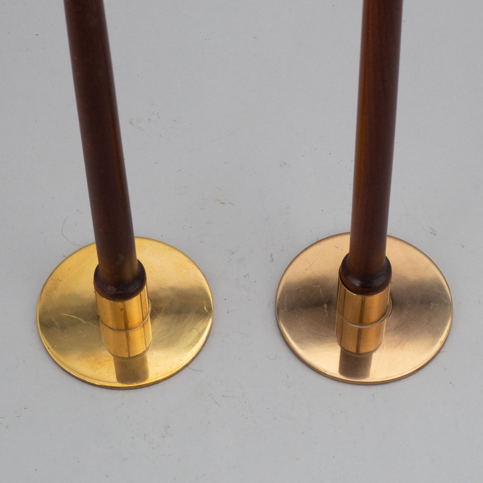 HANS-AGNE JAKOBSSON, a pair of brass and teak candle holders, Markaryd, mid 20th century.