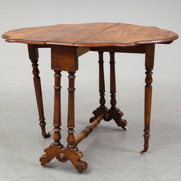 A 19th Century drop leaf table.