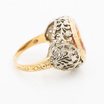 Gold ring with synthetic yellow sapphire.