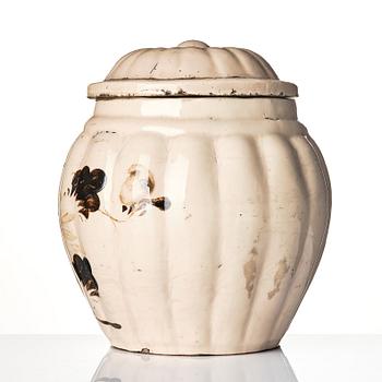 A painted 'Cizhou' 'floral' jar and a cover, late Ming dynasty (1368-1644).

Yuan / Ming dynasty.