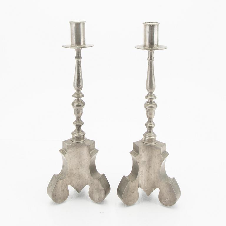 Firma Svenskt Tenn,  a pair of 1928 pewter candle sticks.