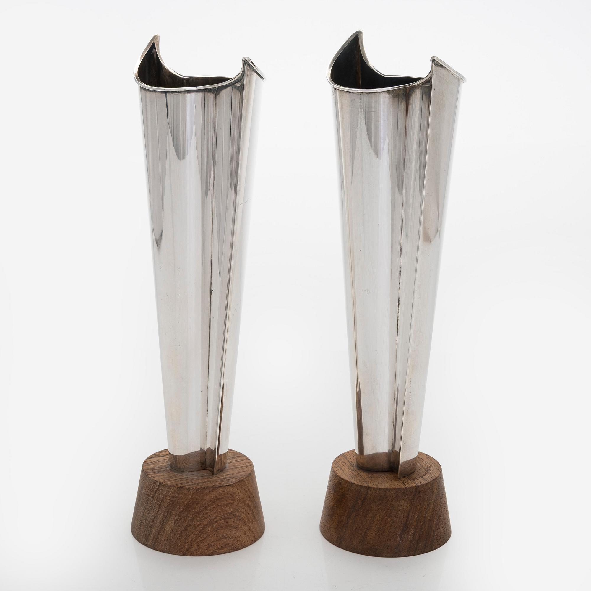Tapio Wirkkala, two silver and teak 'Flame' vases, Kultakeskus, Hämeenlinna 1962 and 1964.