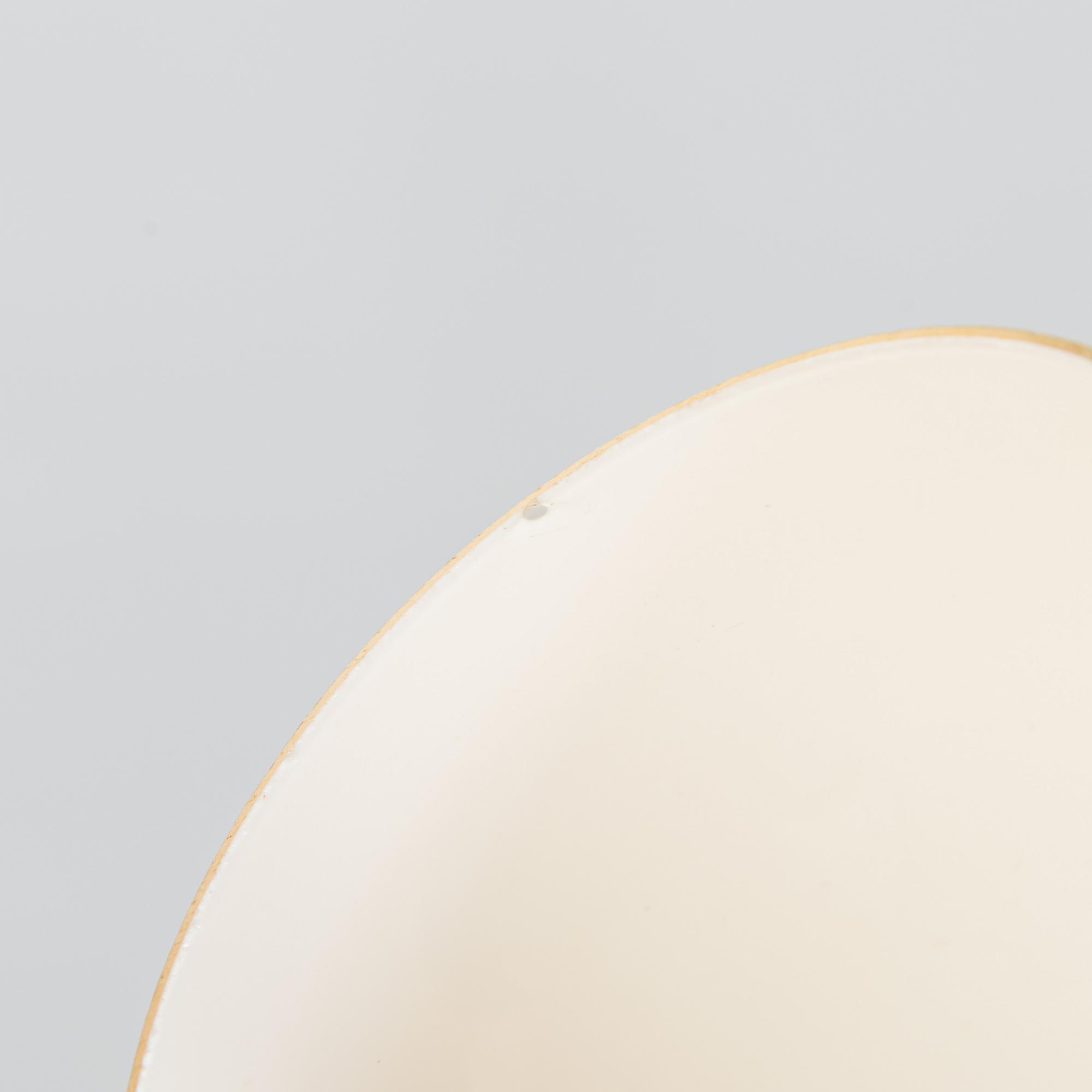 A mid 20th century brass pendant ceiling light, manufactured by Itsu, Finland.