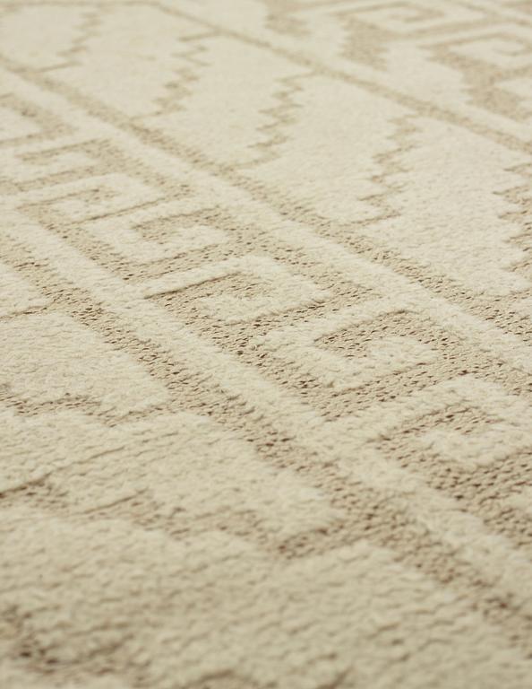Märta Måås-Fjetterström, A CARPET, "Vita spetsporten", knotted pile in relief, ca  177,5 x 121 cm, signed MMF.