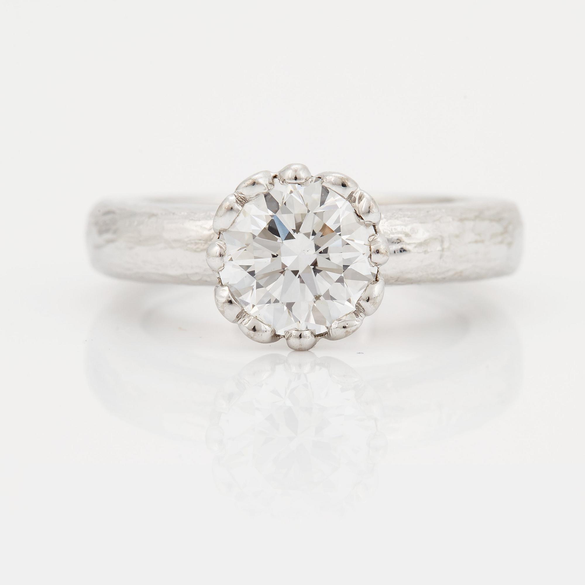 A SOLITAIRE RING.