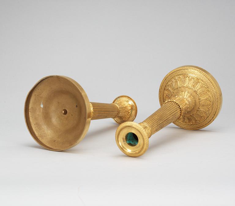 A pair of French Empire early 19th Century candlesticks.