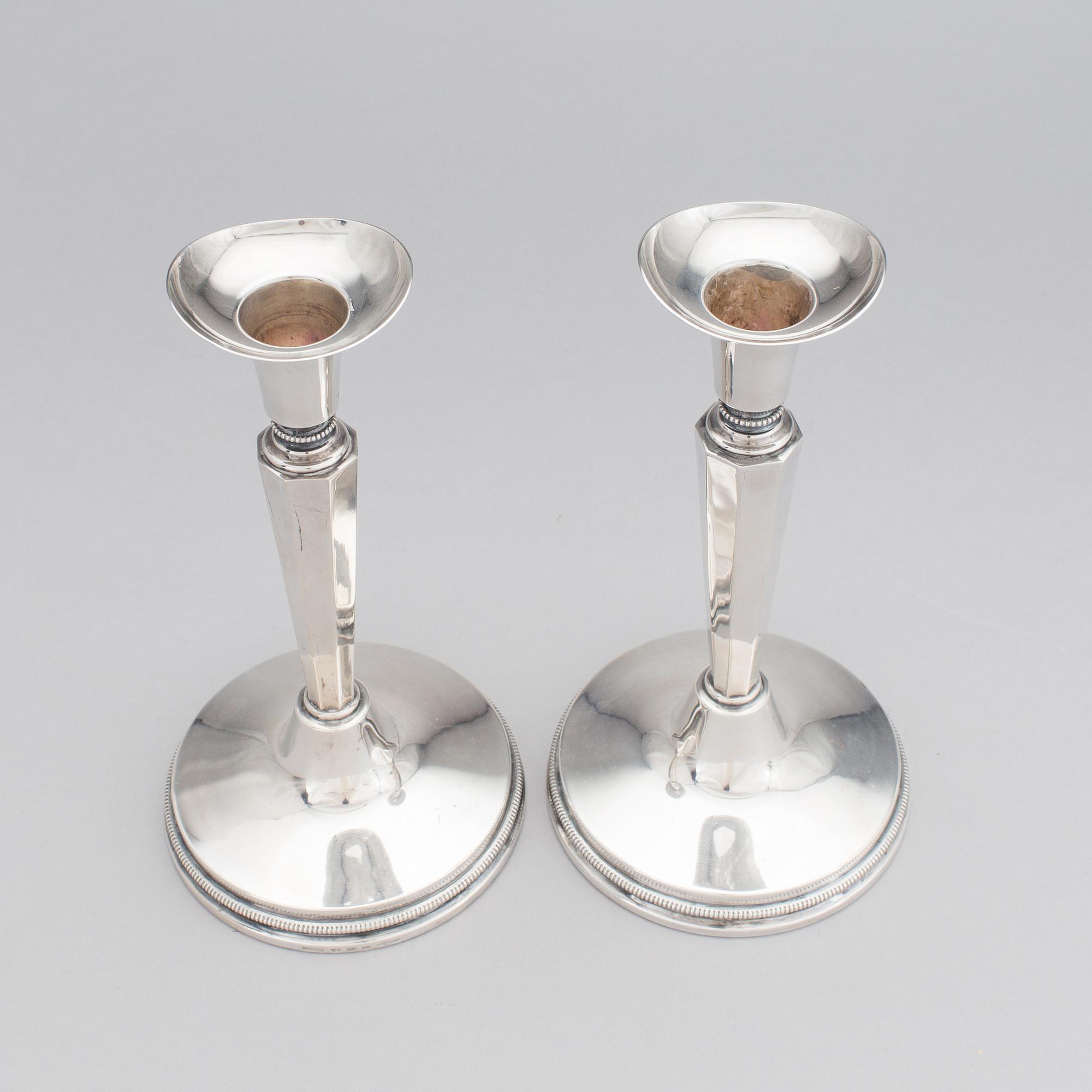 A pair of silver candle stick holders by Erik Löfman, MGAB, Uppsala, 1976.