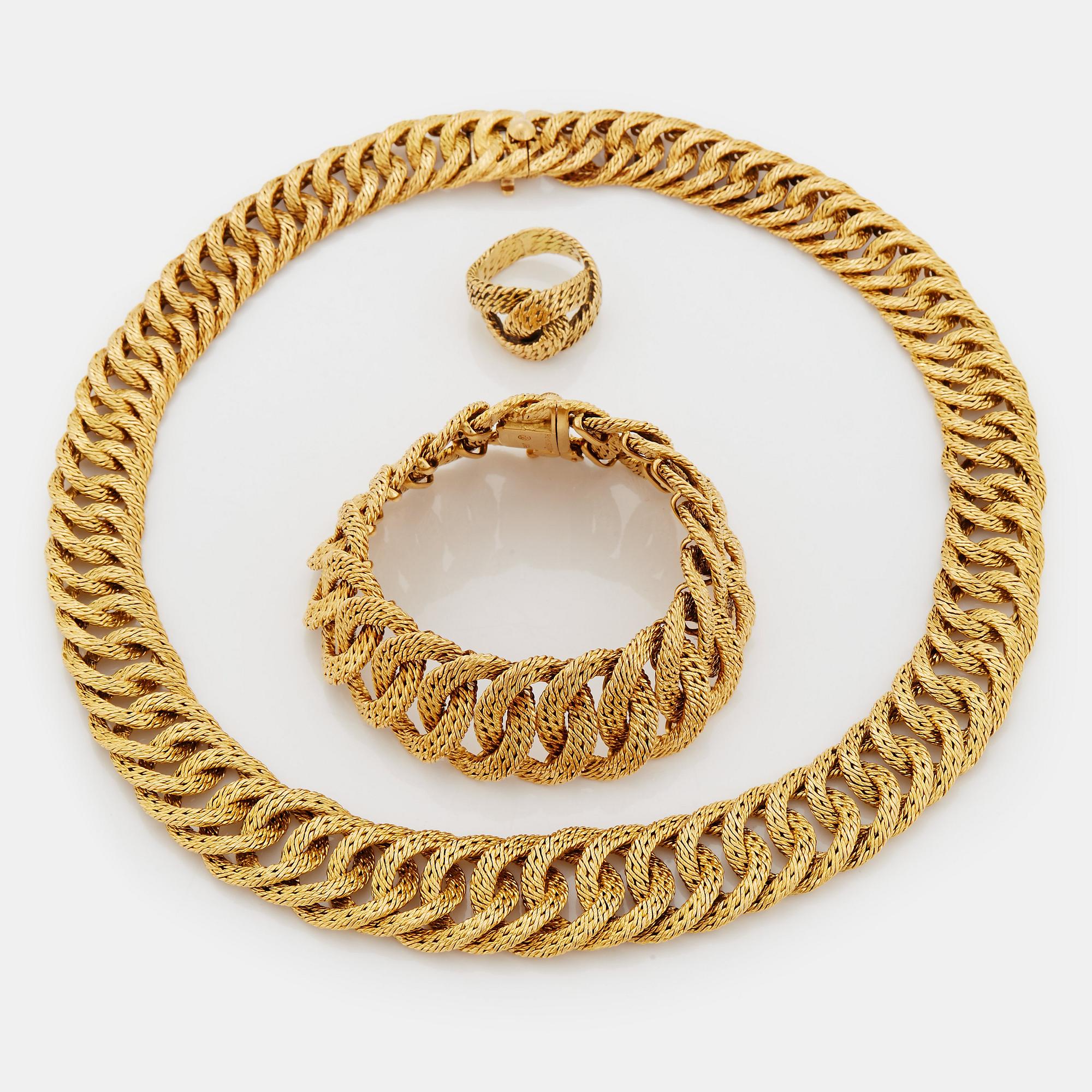 Georges L'Enfant an 18K gold demi parure comprising a necklace, a bracelet and a ring.