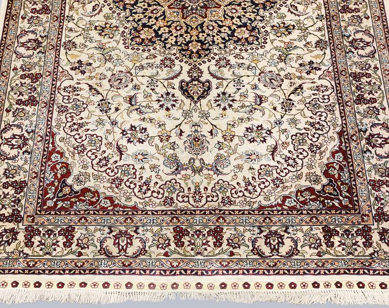 An Oriental silk rug, approx. 153 x 94 cm.