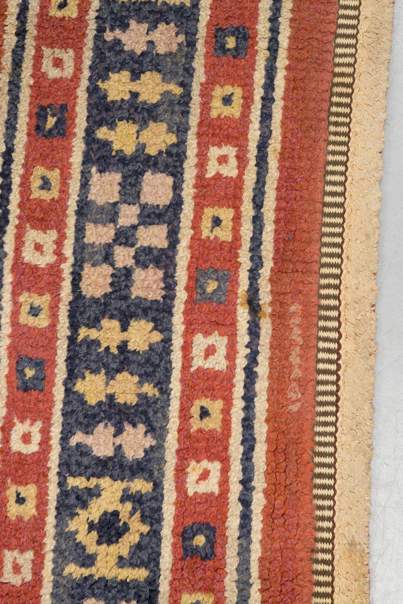 Märta Måås-Fjetterström, a carpet, "Röd Flossa", knotted pile, ca 300 x 272 cm, signed AB MMF.