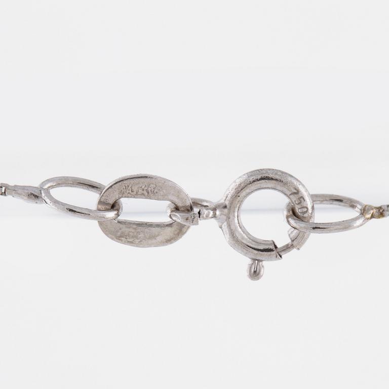 A aquamarine and briliant cut diamond pendant.