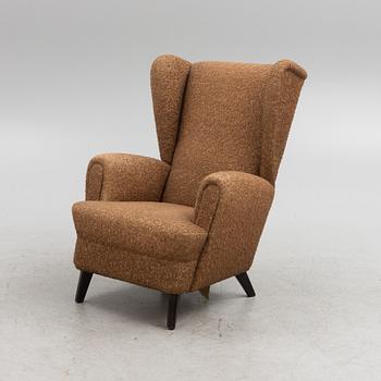 A wingback armchair, mid-20th Century.