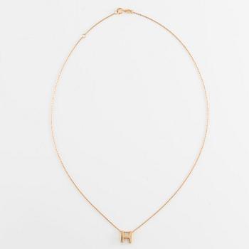 Collier, 18K guld med en berlock av bokstaven H.