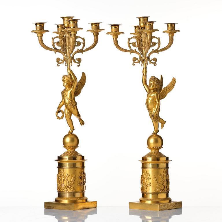 A pair of Empire five lights candelabra.