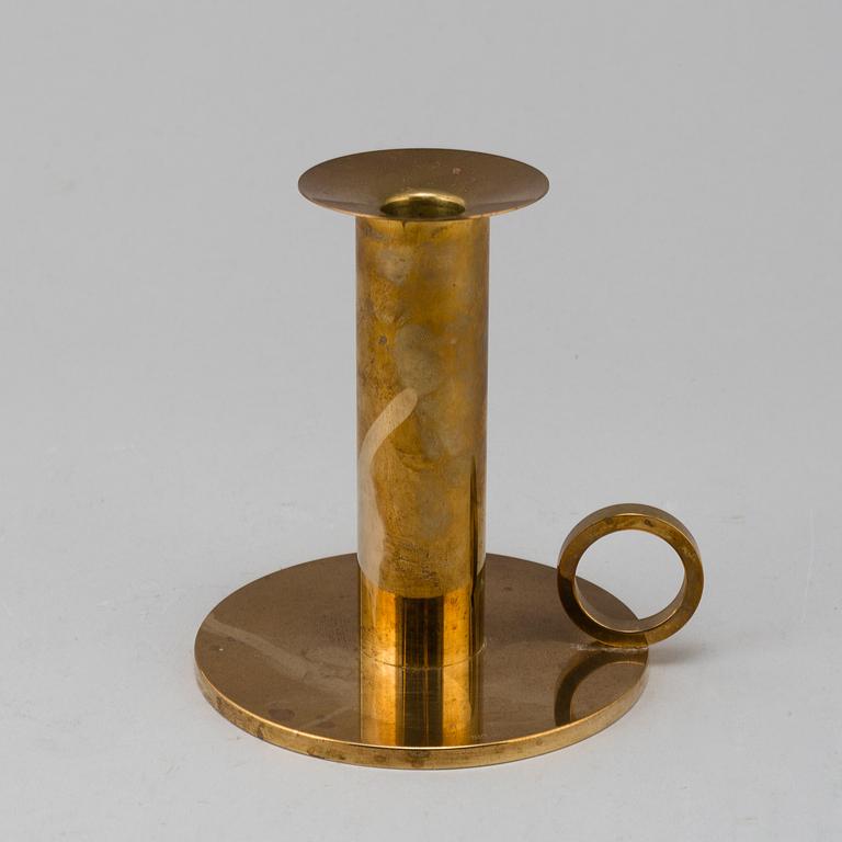 SIGURD PERSSON, a brass candlestick.