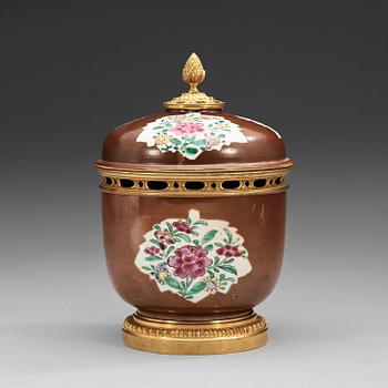 1545. A bronze mounted famille rose jar with cover, Qing dynasty, Qianlong (1736-95).
