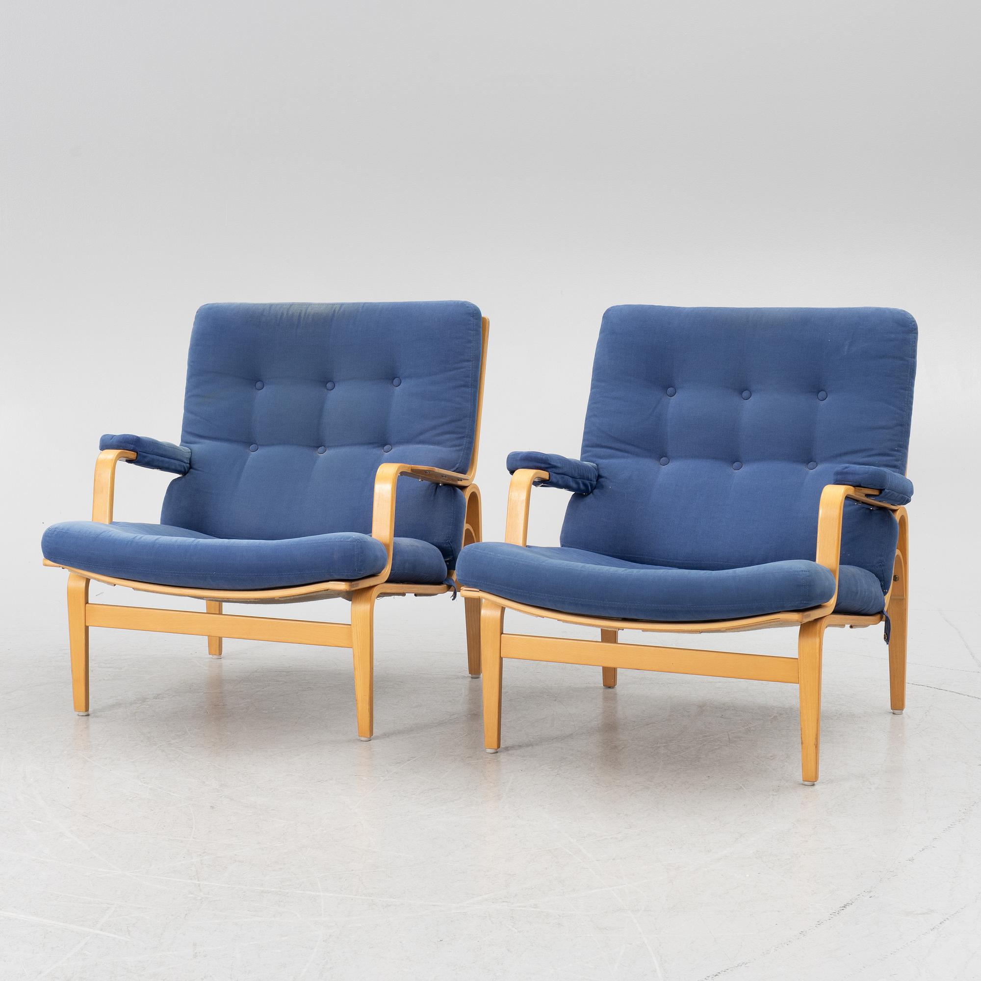 Bruno Mathsson, a pair of armchairs with ottomans, 'Ingrid', Dux, second half of the 20th century.