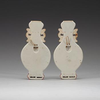 A pair of famille rose wall vases, late Qing dynasty, circa 1900.