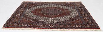 An Oriental rug, approx. 213 x 201 cm.
