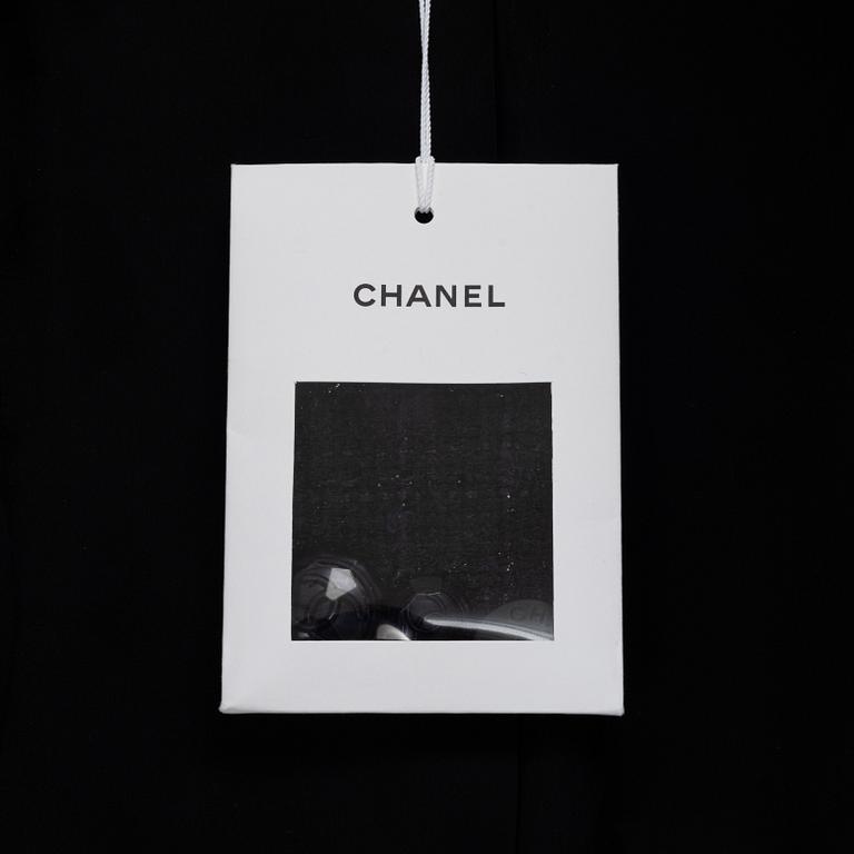 Chanel, a bouclé coat, size 34.
