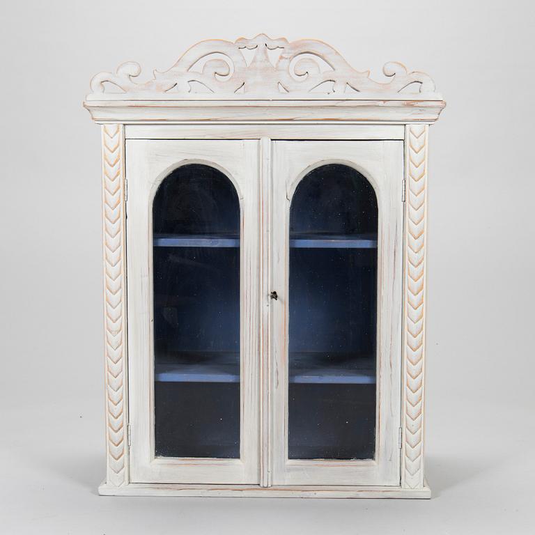 A late 19th-century wooden wall cabinet.