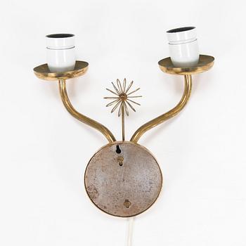A mid-20th century wall light for Korumo.