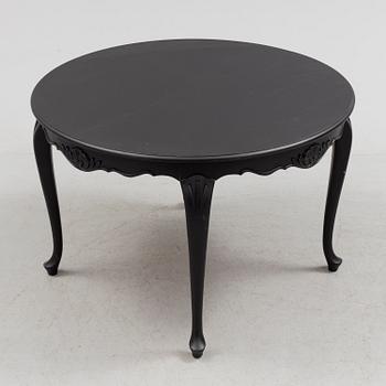 A mid 20th century rococo style dining table.