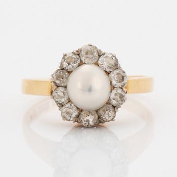 An old-cut diamond and pearl ring.