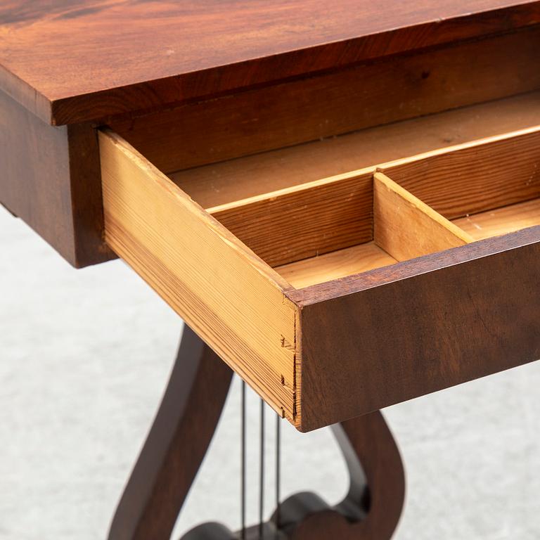 An early 20th century sewing table.