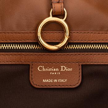 Christian Dior, a brown leather handbag.