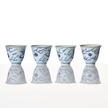 A set of four blue and white dragon wine cups, 'Hatcher Cargo', 17th century.