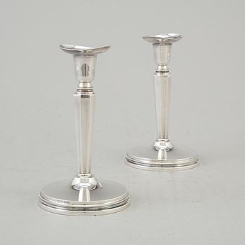 a pair if silver candlesticks by MGAB Uppsala 1962.