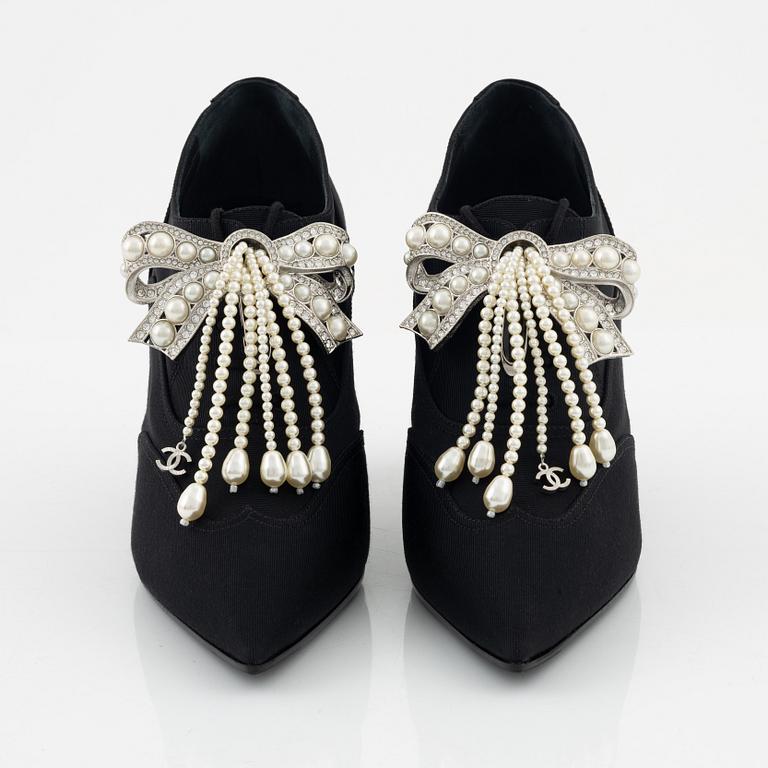 Chanel, a pair of peal and strass bow pumps, size 37.