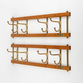 A pair of 'Dekorativ' teak coat hangers, Skoglunds metallgjuteri, Anderstorp, 1950's/60's.