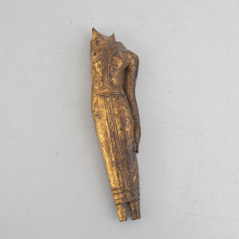Two Thai gilt wooden fragments of figurines, late 19th century.